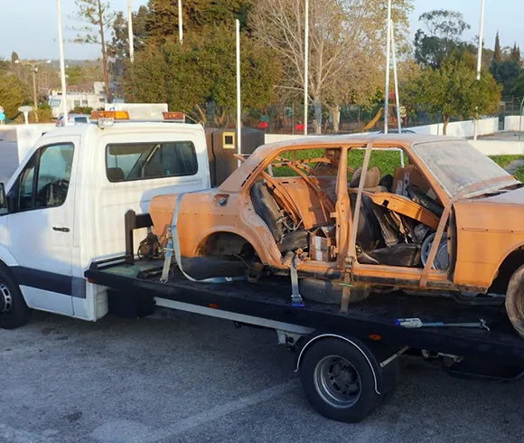 Heavy machinery handling junk cars for removal in Waxahachie, TX