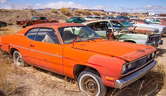 Orange junk car ready for sale in Arlington, TX.