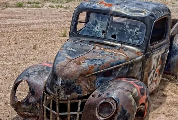 Rusty blue classic car damaged and set for cash junk car purchase in Plano, TX