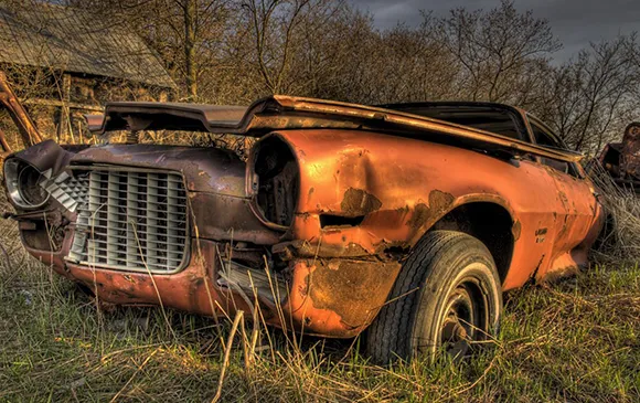 Rusty vintage orange car for junk car cash sale in Waxahachie, TX