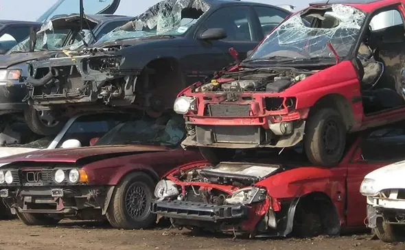 Damaged cars prepared for junk car removal in Rockwall, TX