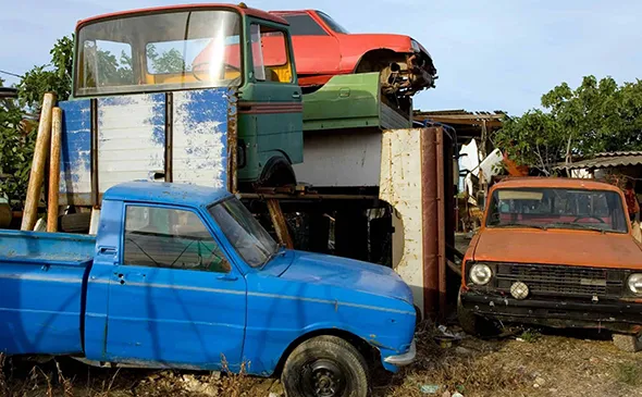 Stacked scrap vehicles in Red Oak TX for hassle-free scrap car removal service