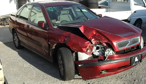 Red car with front-end damage for no title car buyers service in Waxahachie, TX