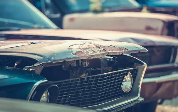 Old green vintage car for top no title car buyers service in Arlington, TX