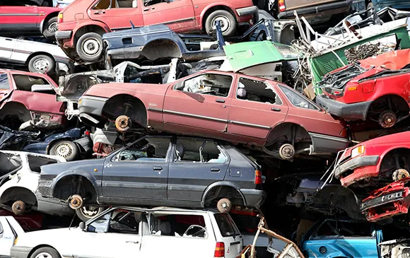 Pile of scrap cars prepared for removal in Red Oak, TX